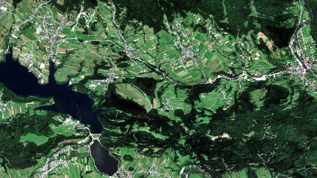 A reservoir seen from orbit, its shoreline traced against the surrounding land